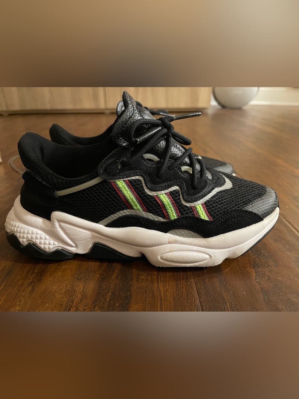 Nike Kids Black Sneakers with Neon Green and Red Stripe Accents